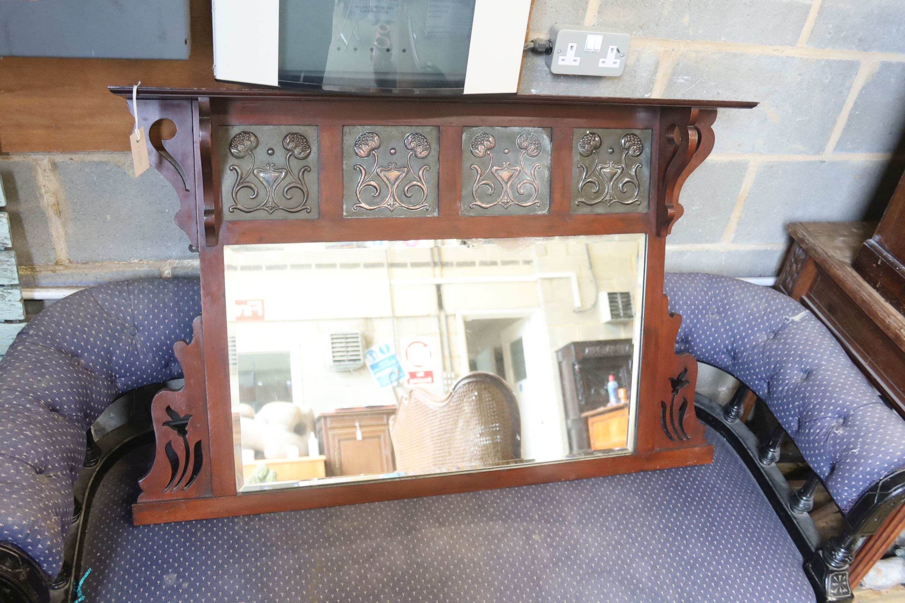 An Art Nouveau mahogany overmantel mirror, width 108cm, height 74cm
